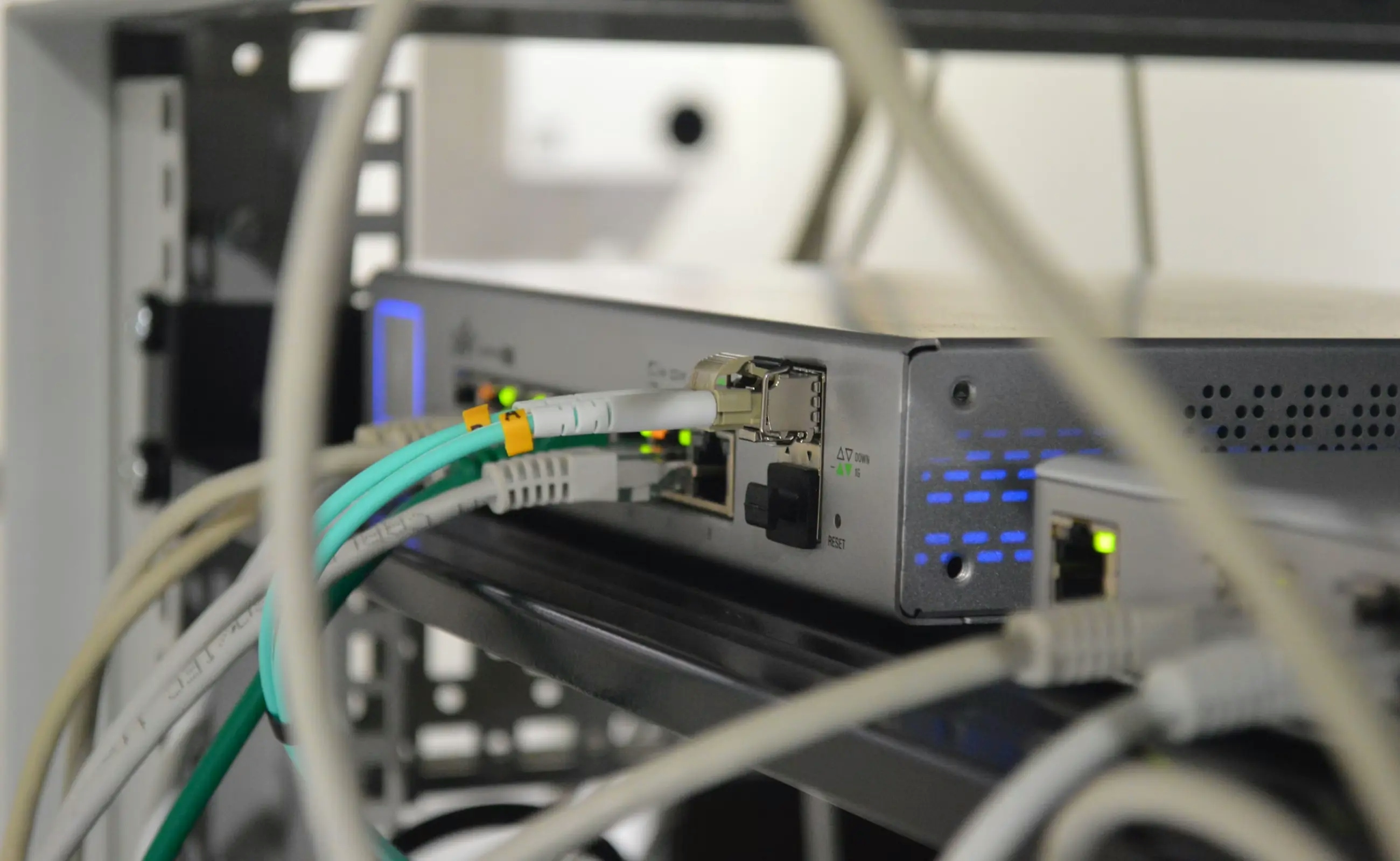 Ethernet & fiber cables connected to Ubiquity router